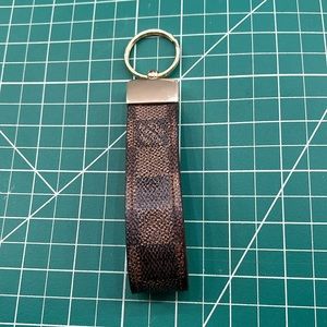Authentic Louis Vuitton leather repurposed into a keychain.